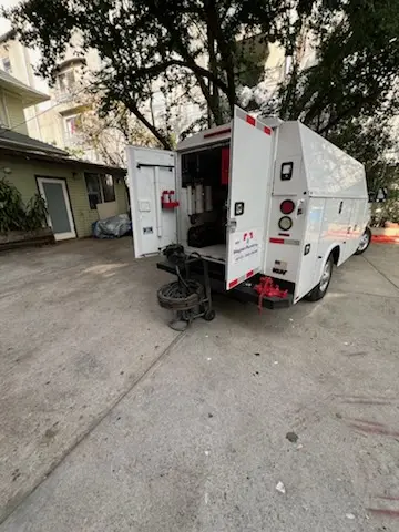 Magnet Plumbing service vehicle on-site for Grease Trap Cleaning in Villa Maria Infirmary